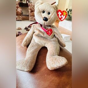 Ty 1999 RETIRED Collectors Beanie Baby 
Tan Teddy Bear with Red Ribbon